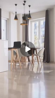 an open kitchen and dining room with white walls