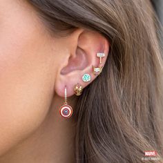 With our Marvel's Captain America Hoops, you can add some Super Hero style to your everyday look. The hoops feature Captain America's iconic shield, with vibrant red, white, and blue enamel detailing that's sure to make a statement. The glimmering stones that line the hoops add an extra level of chicness, making these Captain America Wedding, Marvel Earrings, Panther Earrings, Winged Helmet, Black Panther Necklace, Avengers Icon, Portrait Silhouette, Marvel Jewelry, God Of Thunder