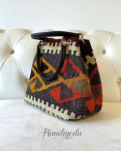 Just added to our Kilim bags collection. This beautiful, unique and practical handmade kilim handbag/ shoulder bag is one of our new collection of top quality hand-woven vintage Kilim bags that combines Turkish rich culture and modern design. The Turkish Kilim wool rugs are sourced from various regions of Turkey. Each of our handwoven old rugs is different and you end up with a unique bag, that really stands out in the crowd. All our products are eco-friendly, no synthetic fibers and chemicals are used. We use best genuine leather, YKK zippers and brass hardware in the manufacturing of our Kilim products. If you want a piece of art that has a rich history of stories and emotions, our bohemian bags are the right choice for you. SIZE: L32cm H26cm W16cm L13″ H10″ W6.5″ ITEM DETAILS: - 100% ha Bohemian Handbags, Boho Traditional, Shoulder Bag Vintage, Kilim Bag, Bohemian Bags, Handwoven Fabric, Soft Clothes, Embroidered Bag, Unique Bags