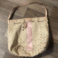 Like New Coach Beige Bucket Bag With Removable Pouch, Coach Beige Bucket Bag, Coach Beige Bucket Bag For Shopping, Coach Double Handle Travel Bucket Bag, Coach Hobo Bag With Dust Bag For Everyday Use, Coach Bucket Bag For Errands, Coach Beige Bucket Shoulder Bag, Coach Bucket Bag With Removable Pouch, Coach Satchel Bucket Bag For Shopping