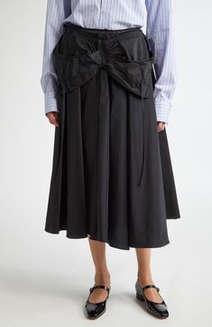 This voluminous taffeta midi skirt features a fold-over waist complete with the maison's 'Work-in-progress' basting stitches. The back sports long ties and an open zip to further the unfinished aesthetic. Back zip closure 100% nylon Dry clean Made in Italy Designer Clothing Nylon Full Skirt For Spring, Spring Full Nylon Skirt, Voluminous Nylon Gathered Skirt, Spring Voluminous Taffeta Skirt, Spring Taffeta Full Skirt, Spring Full Taffeta Skirt, Voluminous Taffeta Full Skirt, Taffeta Gathered Skirt, Open Zip