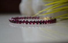 "This Delicate gemstone bracelet is made of Genuine Garnet with Gold vermeil clasp. This bracelet will be a perfect gift for a person who born in January - Garnet is a January birthstone. Garnet beads used in this bracelet are AAA Quality. Garnet works to balance the mind and emotions by helping you discard outdated ways of thinking and giving way to a new path of abundance and vitality. This delicate crystal bracelet is perfect for itself or is simple enough that it can be layered with other br Elegant Ruby Beaded Bracelets With Gemstones, Elegant Ruby Gemstone Beaded Bracelets, Elegant Ruby Gemstone Beads Bracelets, Elegant Burgundy Bracelets As Gifts, Red Faceted Elegant Bracelets, Elegant Red Crystal Bracelet With Gemstone Beads, Elegant Red Faceted Beaded Bracelets, Elegant Red Faceted Bracelets, Red Gemstone Jewelry