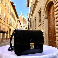 This bag has been made of the best genuine leather by local master crafters of Florence in Italy, designed for women who only accept premium Italian quality and luxury leather bags and modern Italian fashion. . Sizes: Height: 17 cm (6.69 inches) Width: 20 cm (7.87 inches) Depth: 8 cm (3.15 inches) Color: Black . The story of this bag: In the enchanting city of Florence, where the art of leatherwork has been perfected over centuries, a small but renowned workshop stood as a beacon of timeless cra Classic Black Flap Bag As Gift, Classic Black Flap Bag For Gifts, Classic Black Flap Bag Gift, Classic Black Flap Bag For Gift, Luxury Leather Flap Bag As Gift, Luxury Leather Flap Bag For Gifts, Luxury Leather Flap Bag Gift, Timeless Leather Bag As Gift, Timeless Leather Bags Suitable For Gifts