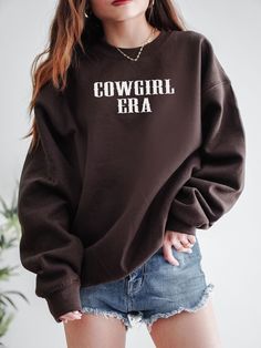 Express your Inner Cowgirl with this cute Cowgirl Era Sweatshirt! This unique cowgirl crewneck is super comfy! Size up for a Trendy Oversized Look! ♥ Hello and Welcome to Meaningful Tees Shop! ♥ Printed on the most popular Unisex Sweatshirt, the Gildan 18000 is 50% Cotton / 50% Poly. The soft fleece lining makes it super Comfy and is sure to become your new favorite! ♥ All of our items are made to order with care for each customer : ) ♥ Please allow 3-7 BUSINESS days (usually 3-5) for your item to be created PLUS shipping time via USPS ♥ This Unisex Sweatshirt fits like a Men's on Women, but is not overly large. ♥ For a RELAXED FIT, your usual size will typically work, but please consult the Size Chart in the Listing Photos ♥ For an OVERSIZED FIT, size up 1, 2, or 3 Sizes! (2 sizes up is t Casual Fall T-shirt With Cow Print, Casual Cow Print T-shirt For Fall, Casual Cow Print Tops For Fall, Casual Long Sleeve Tops With Cow Print, Casual Long Sleeve Cow Print Top, Casual Cow Print Crew Neck Top, Casual Crew Neck Cow Print Tops, Cotton Crew Neck Top With Cow Print, Casual Cow Print Tops With Relaxed Fit