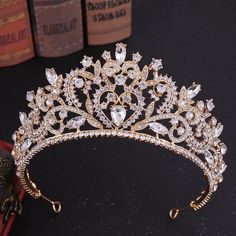 a gold tiara with crystal stones on it