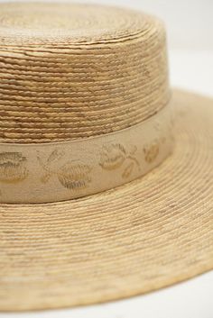 Fine palm leaf straw boater hat Luxury Toquilla Straw Boater Hat With Short Brim, Luxury Summer Hats Made Of Palm Leaf, Luxury Woven Boater Hat In Toquilla Straw, Luxury Palm Leaf Panama Hat For Spring, Luxury Brimmed Palm Leaf Hat, Luxury Woven Natural Boater Hat, Luxury Curved Brim Sun Hat In Palm Leaf, Luxury Cream Toquilla Straw Sun Hat, Luxury Adjustable Gold Straw Hat