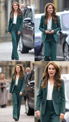 the woman is walking down the street in her green suit