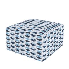 a blue and white ottoman cover with an animal print pattern on the top, sitting in front of a white background