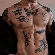 a man with many tattoos on his chest