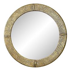 a round mirror with an intricate design on it