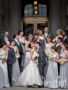 a group of people that are standing in front of a building