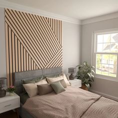 a bed sitting under a window next to a painting on the wall in a bedroom