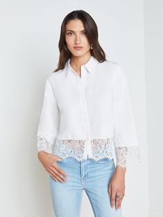 The Levo is our romantic updated to the classic white shirt. The boxy, cropped silhouette has a cool, effortless feel balanced by feminine floral lace trim. A sharp collar and button front offer a crisp, classic finish. Slip on over a slim jean or short for a fresh weekend look. | L'AGENCE Levo Lace-Trim Shirt In White Spring Daywear Tops With Lace Cuffs, Collared Top With Lace Cuffs, Elegant Cropped Shirt, Elegant Shirt With Lace Collar For Spring, Spring Cropped Blouse With Lace Collar, Collared Shirt With Lace Trim For Spring, Spring Collared Shirt With Lace Trim, Spring Button-up Top With Lace Cuffs, Elegant Cropped Shirt For Summer