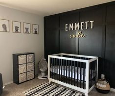 a baby's room with black and white decor