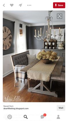 a dining room table with chairs and a chandelier