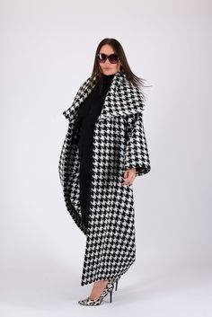 Women Houndstooth Coat, Wool Winter Coat, Long Cape Coat Black and white Coat-Vest with two side pockets, loose fit,  long sleeves and big collar.  * The coat don't have a lining and buttons.  SIZE & FIT: *Our Model is 5′6″ / 175 cm and wears size M. *Available Sizes: form XS up to 8XL *This product could be customized according to your measurements. *Please leave your requirements in the checkout. CARE Dry Cleaning  Machine Wash 30oC Hand Wash with warm water Medium hot iron Time to ship & DELIVERY : Your piece will be ready to ship in 5-6 biz days upon placing your order. UPS Express Worldwide - 3-4 days delivery time Explore the rest of my collection here: https://www.etsy.com/shop/EUGfashion  For any Personal questions and Business queries, please do not hesitate to contact us. Thank y Mantel Cape, Long Cape Coat, Coat Cape, Black And White Coat, Long Cape, Elegant Shawl, Houndstooth Coat, Wool Winter Coat, Big Collar