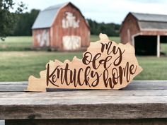 a wooden sign that says my old kentucky home