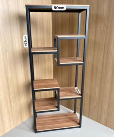 the shelf is made out of wood and has three shelves on each side, one with two