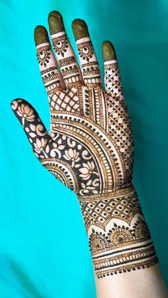 the hand is decorated with intricate designs