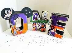 the letters are decorated with halloween characters