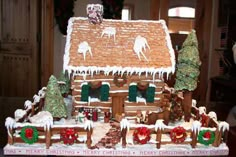 a gingerbread house decorated with icing and decorations