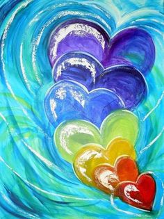 colorful hearts floating in the water with blue waves