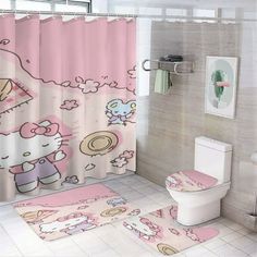 a bathroom with hello kitty shower curtain and rugs