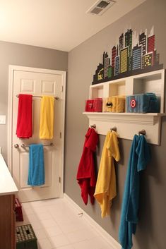 a bathroom with towels hanging on the wall