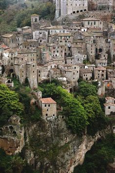 an aerial view of a village on top of a mountain