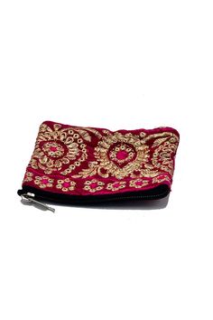 Elevate your accessory collection with this exquisite coin pouch, showcasing the intricate art of Zari embroidery. This handmade pouch features a striking combination of multiple colors and gold threads, meticulously woven into floral and paisley patterns. Perfect for the modern bohemian chic, this Banjara small pouch offers both style and functionality. Ideal for carrying coins and small essentials, it adds a touch of traditional elegance to your everyday look. Keywords: bohemian chic accessori Handmade Gold Bohemian Pouch, Traditional Multicolor Embroidered Pouch, Bohemian Handmade Brown Pouch, Traditional Multicolor Embroidered Pouch Bag, Traditional Red Rectangular Pouch, Small Pouches, Gold Threads, Modern Bohemian, Bohemian Chic