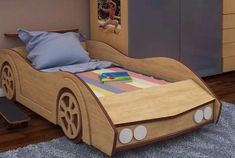 a child's bed made to look like a race car with wheels on it