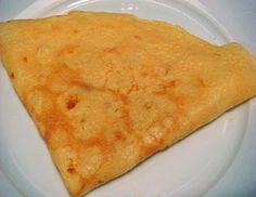 a white plate topped with a piece of cheese quesadilla on top of a table