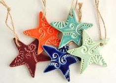 four starfish ornaments hanging from twine