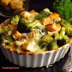 a casserole dish with broccoli and cheese