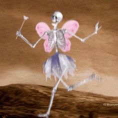 a skeleton dressed as a fairy dancing in the desert with a pink flower on it's back