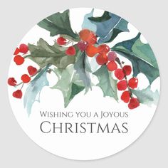 a christmas sticker with holly and berries