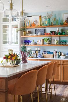 a kitchen filled with lots of counter top space next to a dining room table and chairs