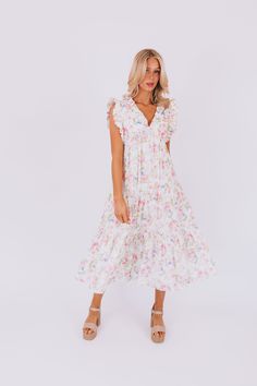 This flirty Take Me Back Dress is the perfect way to add some floral fun to your wardrobe. With a flattering V-neckline and playful ruffle details, you'll turn heads wherever you go. Don't miss out on this must-have piece. Details Floral pattern V-neckline Ruffle details Sizing Approximate measurements: SIZE LENGTH BUST Small 47" 38" Medium 48" 40" Large 49" 42" Fabric has no stretchModels are 5’10 wearing small Material 100% CottonHand wash coldHang to dry Spring Midi Dress With Ruffle Hem For Garden Party, Spring Ruffle Sleeve Midi Dress For Garden Party, Spring V-neck Floral Dress For Brunch, Spring Garden Party Midi Dress With Ruffle Sleeves, Feminine Floral Midi Dress With Ruffle Hem, Feminine Midi Floral Dress With Ruffle Hem, Spring Floral Print Flutter Sleeve Dresses, Feminine Spring Midi Dress With Ruffle Hem, Spring Floral Print Dresses With Flutter Sleeves