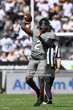 a football player throwing the ball during a game