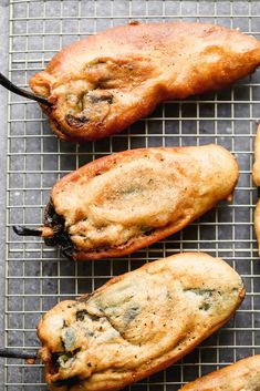 some food that is sitting on a wire rack and ready to be cooked in the oven