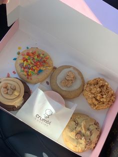 a box filled with lots of different types of cookies