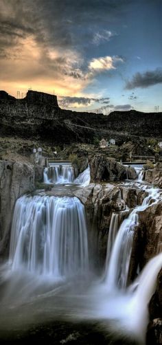 the waterfall is flowing into the water