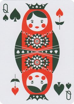 a card with two dolls on it and playing cards in the background