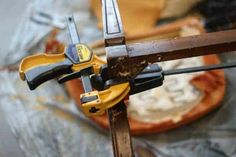 a pair of pliers are sitting on top of a piece of wood