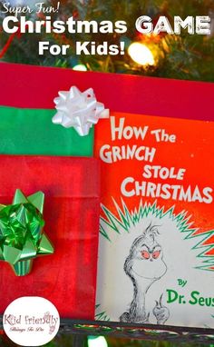 the grin stole christmas tree is decorated with green and red wrapping paper, bows, and a book