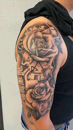 a woman with a clock and roses tattoo on her arm