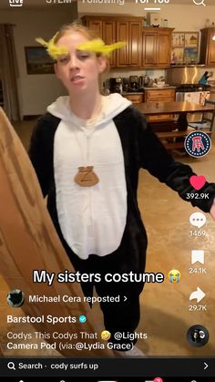 a person in a costume with yellow hair on their head and the caption my sisters costume