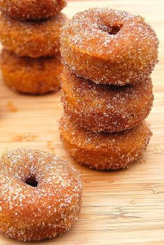 several sugared donuts stacked on top of each other