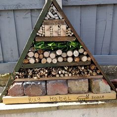 a pyramid made out of rocks and logs