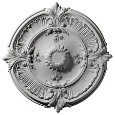 an ornately designed ceiling medallion in white